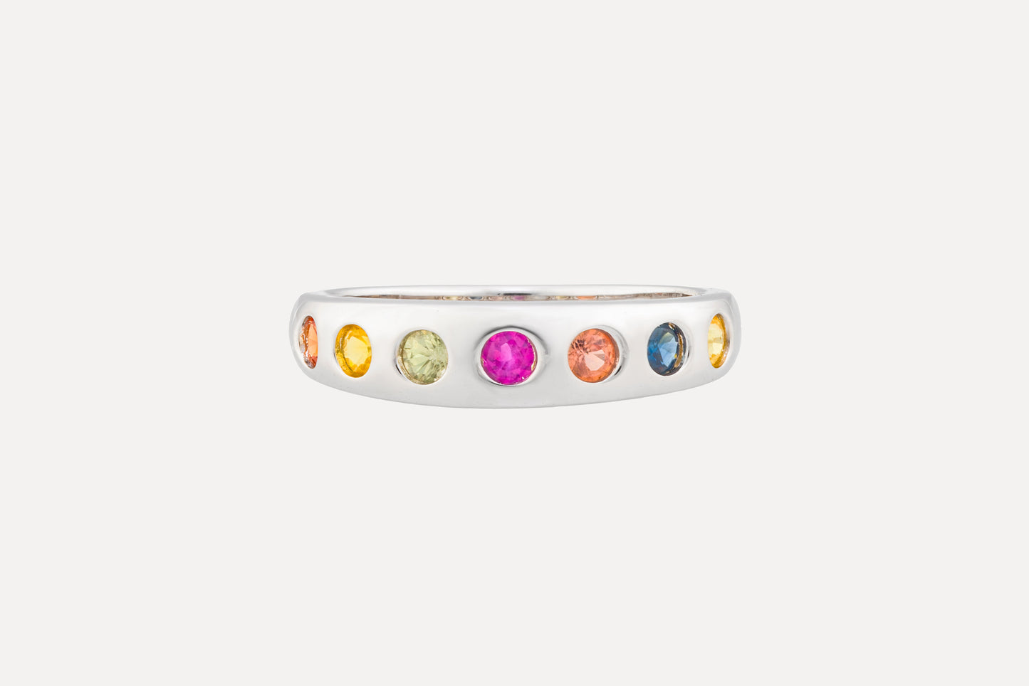 Multi coloured sapphire eternity ring in sterling silver with rhodium plating.