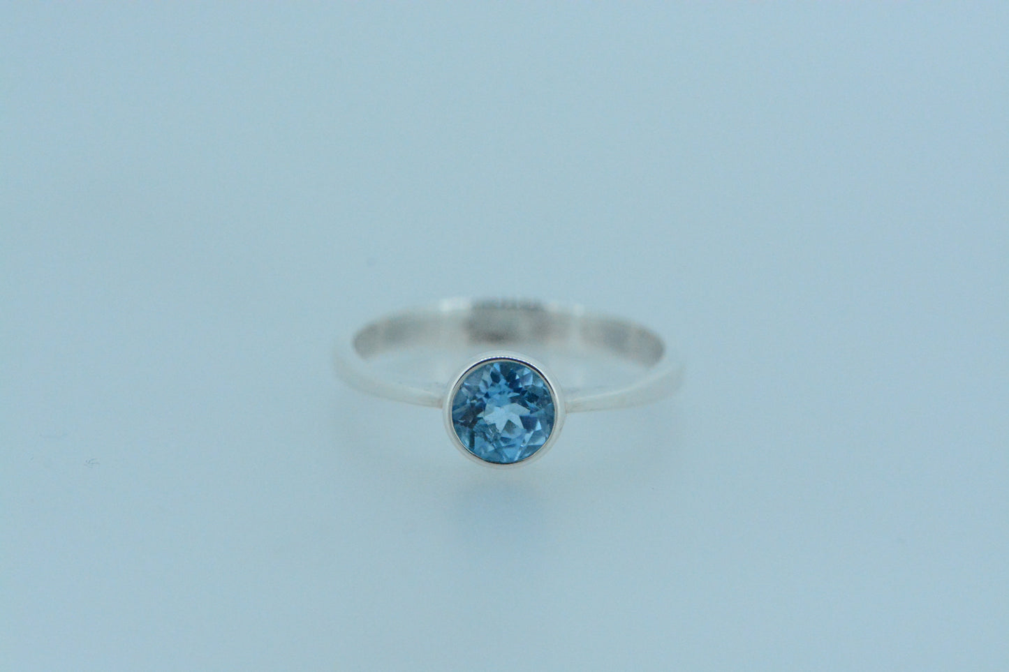 Round Blue Topaz Solitaire Ring