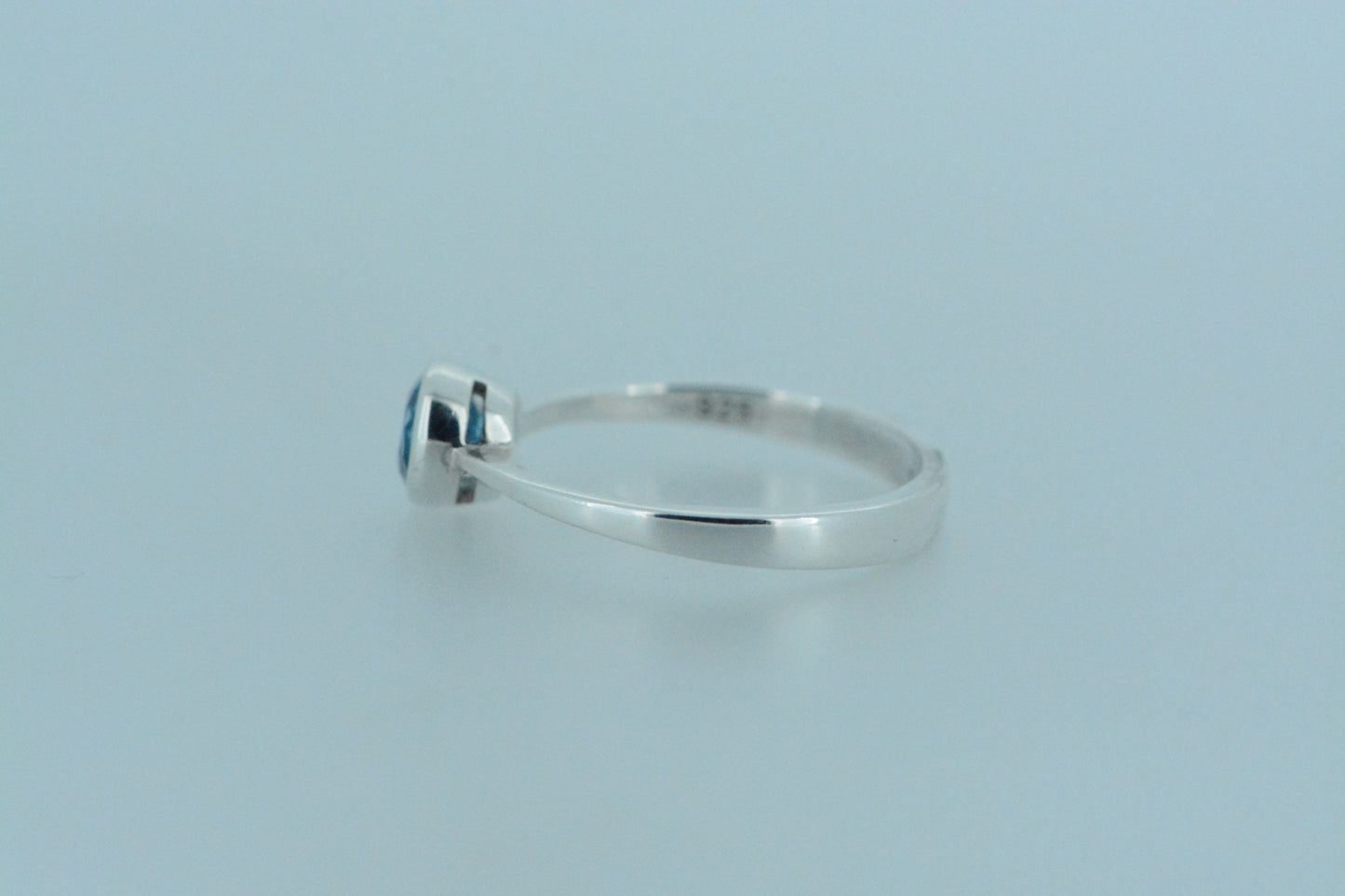 Round Blue Topaz Solitaire Ring
