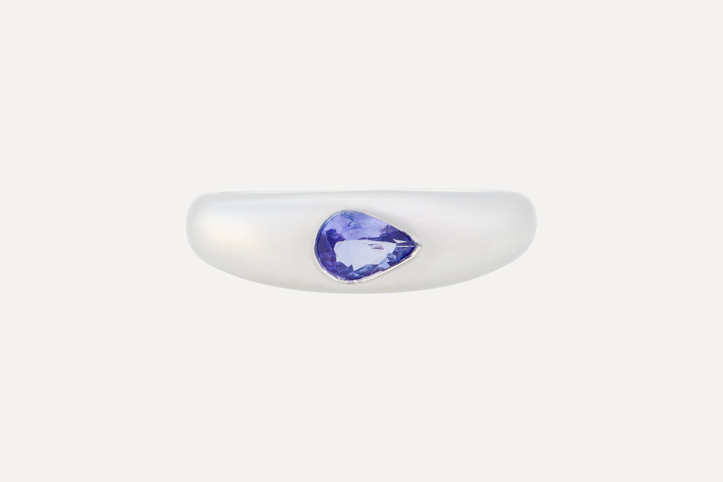 A sterling silver ring is set with a pear cut tanzanite stone with rhodium plating for a dazzling finish. A simple yet sophisticated look of a water-drop.

A mesmerizingly beautiful tanzanite stone from the Merelani foothills of Kilimanjaro.