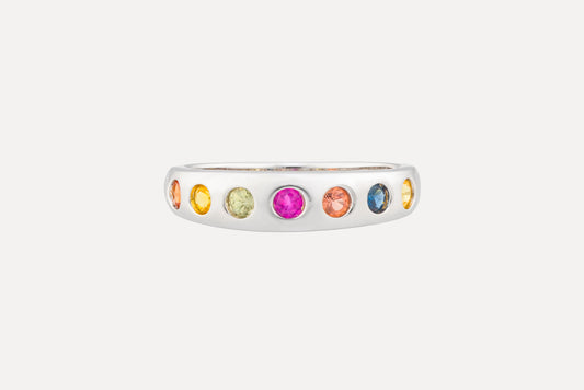 Multi coloured sapphire eternity ring in sterling silver with rhodium plating.