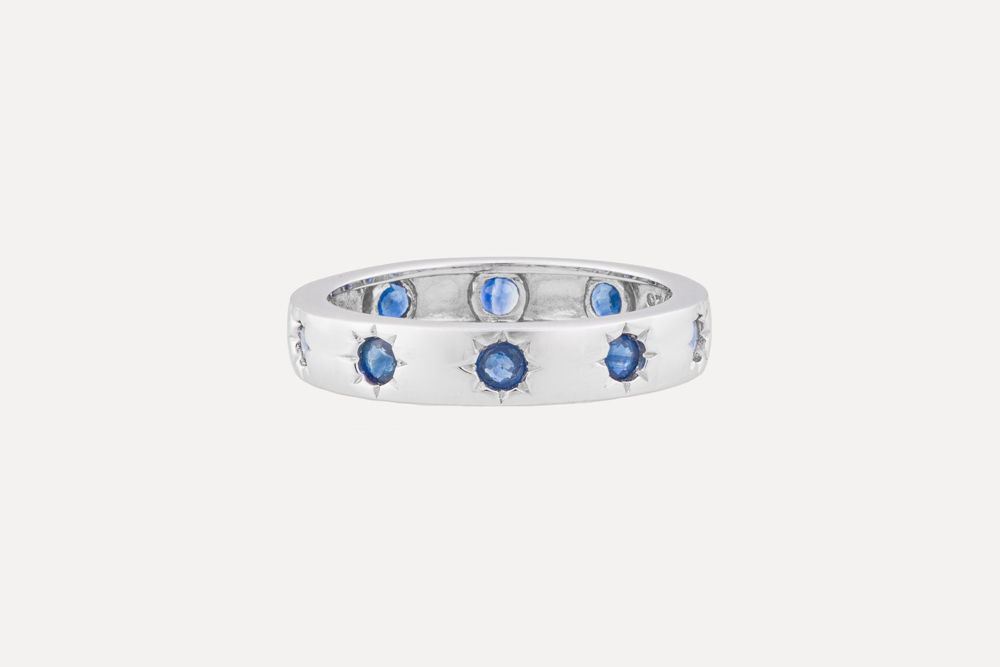 Full circle blue sapphire eternity ring sterling silver with rhodium plating.