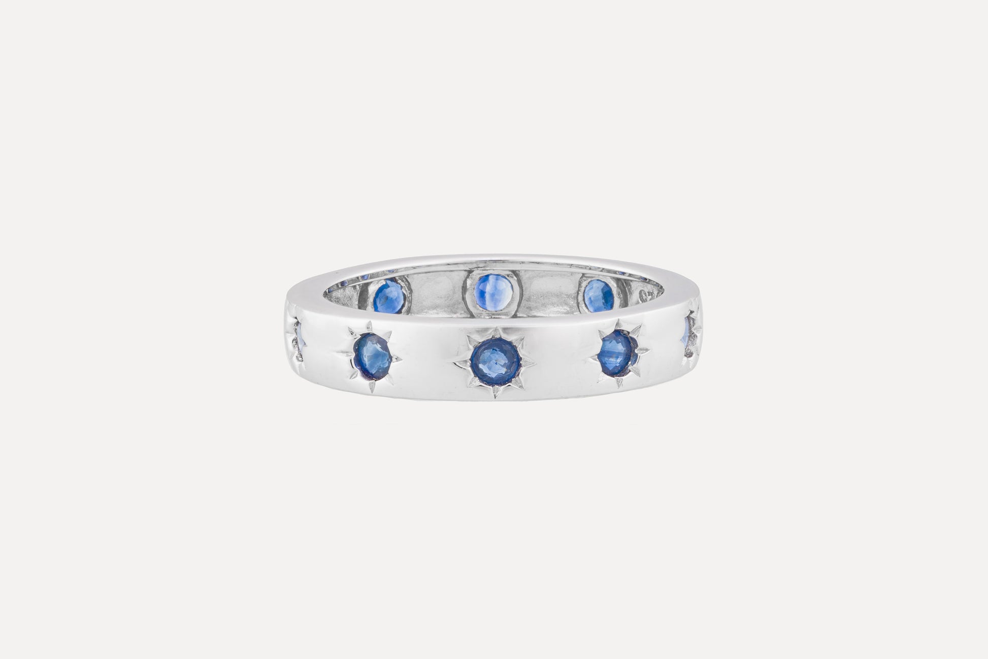 Full circle blue sapphire eternity ring sterling silver with rhodium plating.