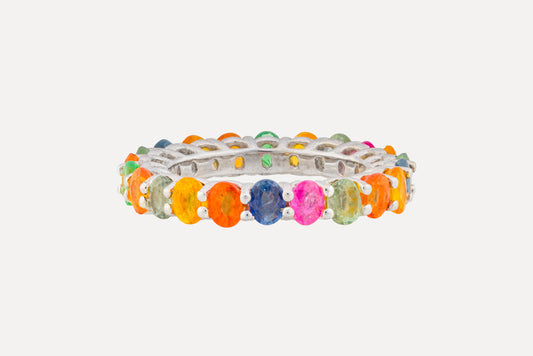 Crafted in sterling silver with a full circle of multi-coloured oval cut sapphires in a claw setting. Finished in rhodium plating for a dazzling look.