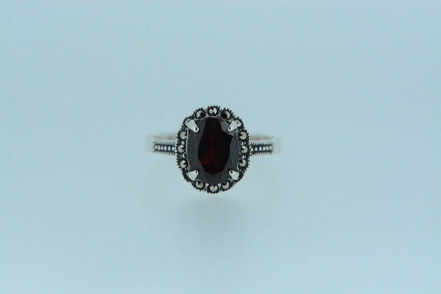 Showcase natural beauty with this sterling silver African garnet ring. Genuine gemstone elegance from Lucy Jurado in dark red.